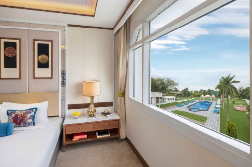 Deluxe Room with Pool View at Tajview, Agra Deluxe room with a pool view at Tajview, Agra - IHCL SeleQtions, one of the best hotels in Agra.