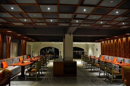 Elegant Dining Area - Gateway Varkala Elegant dining area at Gateway Varkala, featuring a variety of culinary options in a sophisticated setting near Varkala beach.