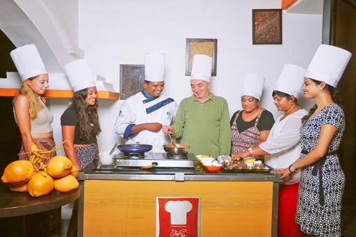 Cooking Class - Coastal Kitchen Varkala Guests participating in a cooking class at Coastal Kitchen Varkala, guided by a chef, learning to prepare traditional dishes and enjoying a fun culinary experience.