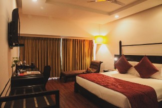 Luxurious Bedroom - 5 Star Hotel in Varkala Luxurious bedroom at a 5 star hotel in Varkala featuring modern amenities, stylish decor, and a comfortable seating area for a relaxing stay.