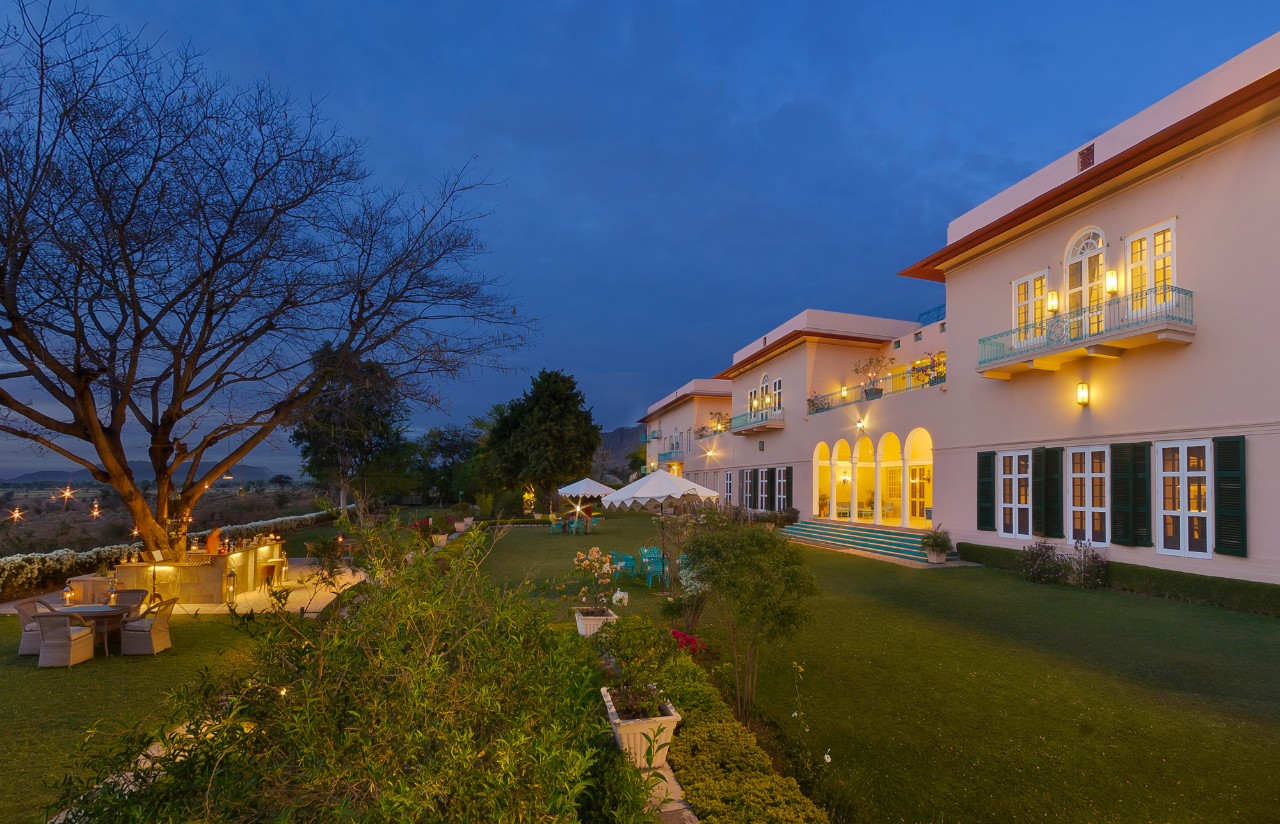 Facade of Ramgarh Lodge, IHCL SeleQtions, illuminated in the evening, a top heritage hotel in Jaipur.