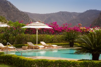 Swimming Pool with Aravalli Hill View at Ramgarh Lodge Outdoor swimming pool with Aravalli hill view at Ramgarh Lodge, IHCL SeleQtions, a 5-star hotel in Jamwa Ramgarh.