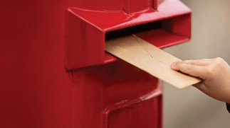 Hand Holding Envelope. Voting By Mail For Absentee Ballot Or Mail-in Voting In The Presidential Elec alternate text for image