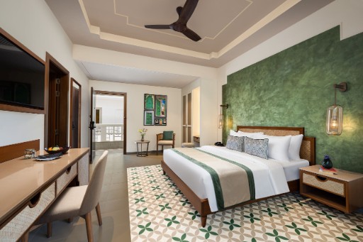 Deluxe Room with Balcony - The Yellow House Goa Deluxe room with balcony at The Yellow House, Goa, offering a relaxing atmosphere with a private balcony.