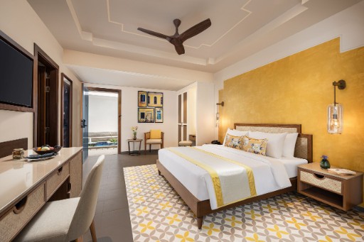Deluxe Room - The Yellow House Goa Deluxe room with garden view at The Yellow House, Goa, featuring comfortable furnishings and a scenic view. Best for guests looking to book a hotel in Anjuna Beach.