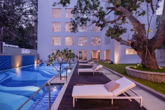Pool at Night - The Yellow House Goa Night view of the pool at The Yellow House, Goa, highlighting the serene and inviting ambiance for evening relaxation.