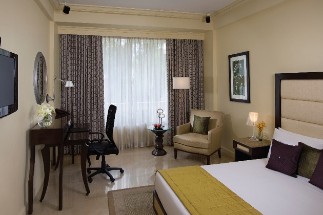 Premium Indulgence Room at Blue Diamond, Pune Premium Indulgence Room at Blue Diamond, Pune, offering a comfortable bed, stylish furnishings, and a relaxing ambiance, making it one of the best hotels in Pune