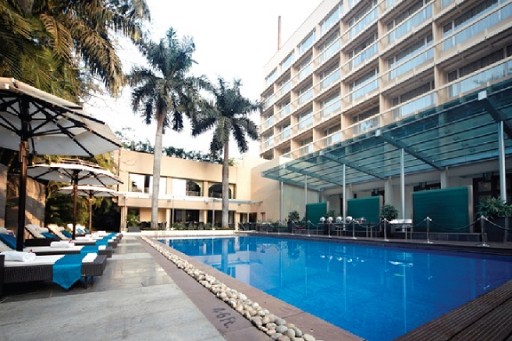 Pool Area at Blue Diamond, Pune Inviting pool area at Blue Diamond, Pune, surrounded by lush greenery and comfortable lounge chairs, ideal for relaxation at a 5-star hotel in Koregaon Park